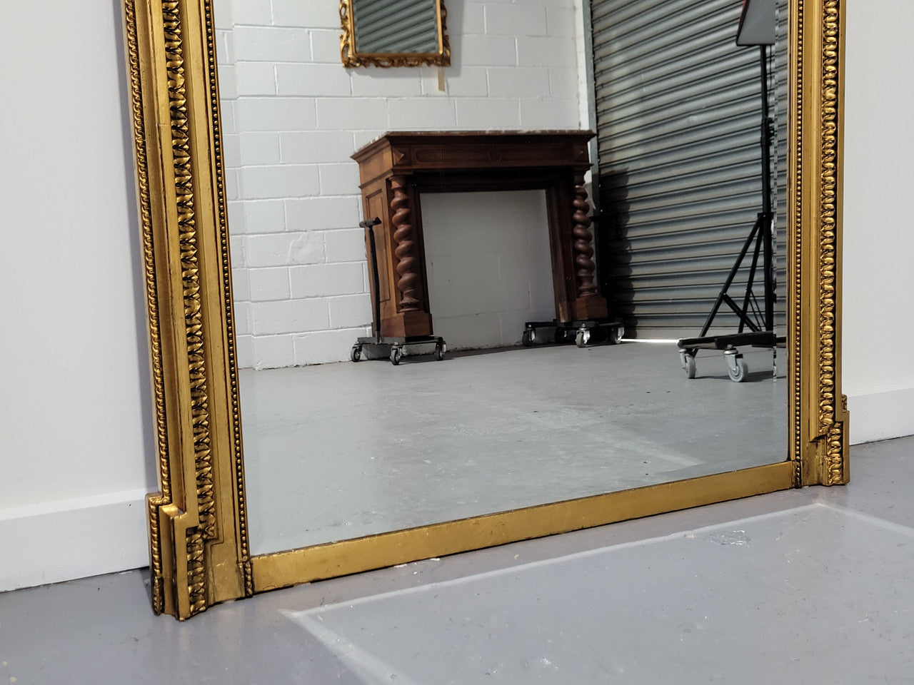 Substantial Louis XI style French Antique over mantel mirror. It is in very good restored condition.