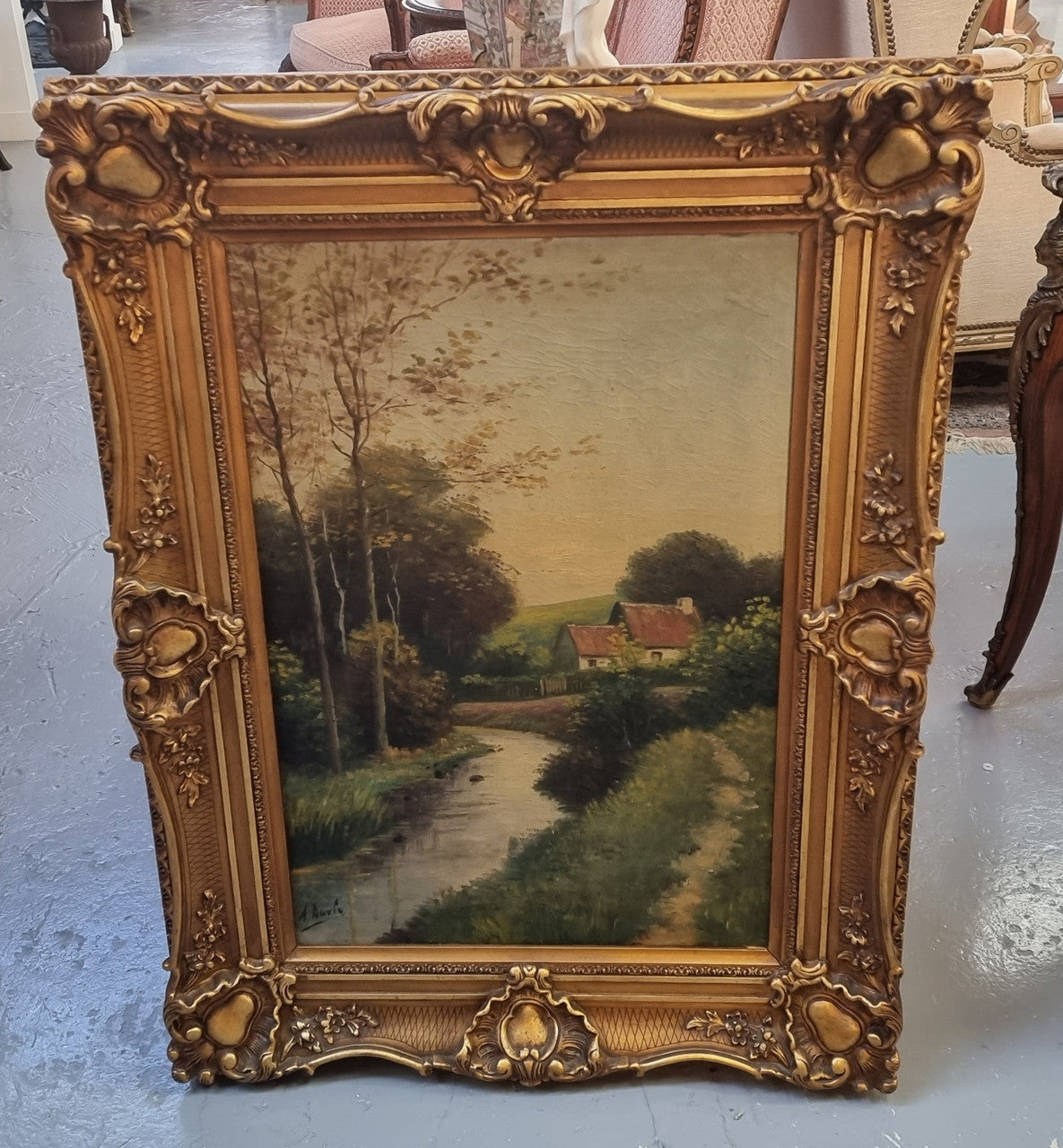 Lovely signed landscape river scene oil on canvas framed in a beautiful ornate frame and in good original condition.