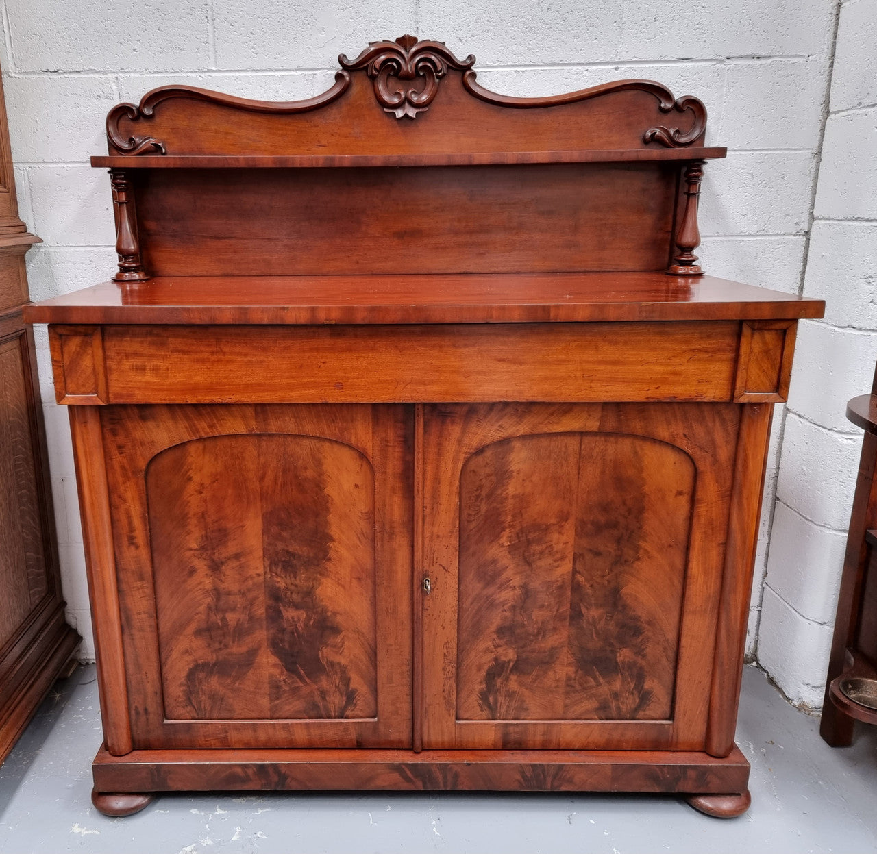 Beautiful Antique Rosewood Chiffonier with a cupboard, two doors and a drawer for all your storage needs . In good original detailed condition.