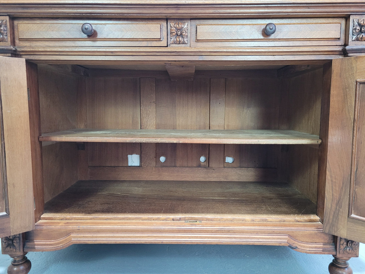 Stunning French walnut Henry II style marble top side cabinet with two drawers and two shelves inside. In good original detailed condition.