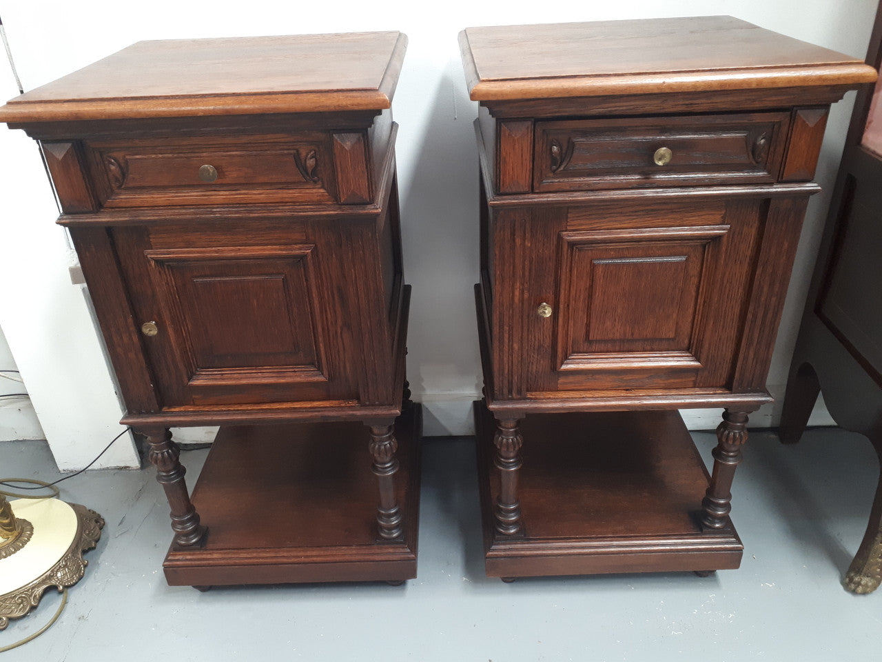 A hard to find pair of French Oak wooden top bedside cabinets. In good original condition. Circa 1920.