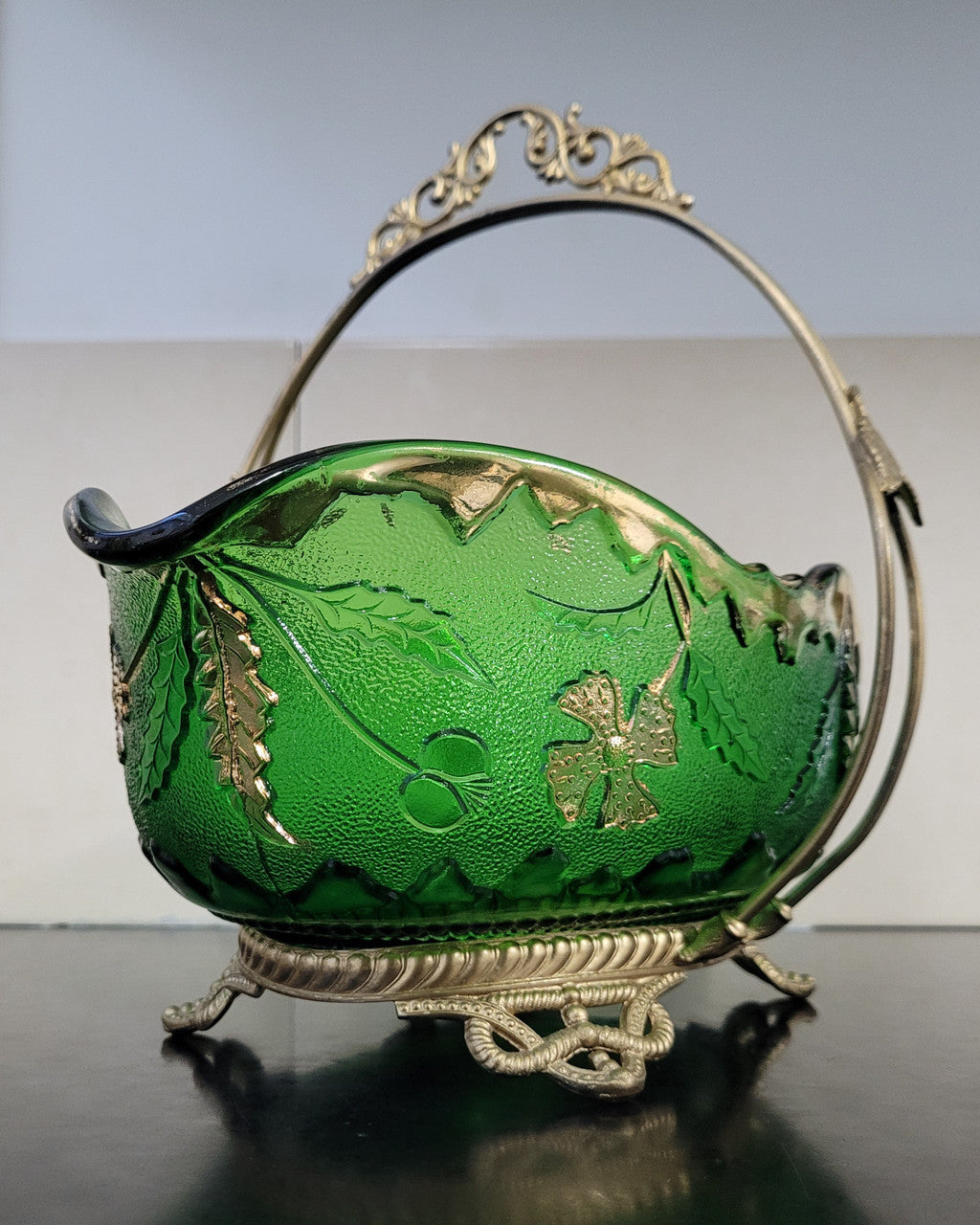 Victorian emerald green and gilt decorated glass bowl with ornate gilt metal stand. It is in good original condition, please view photos as they help form part of the description.