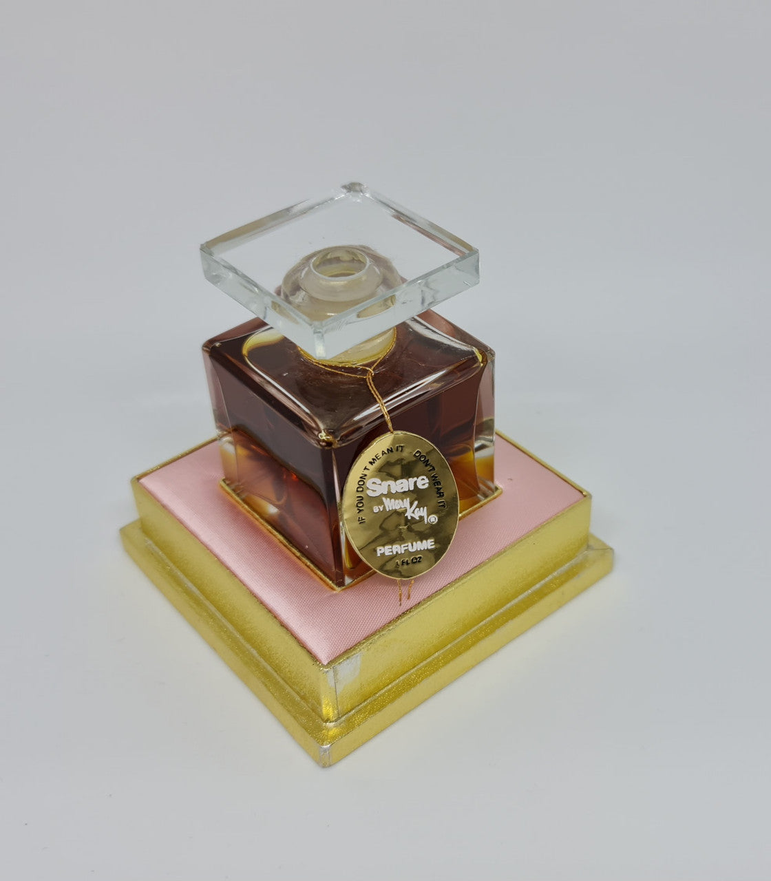 Beautiful Vintage snare "Mary Kay" French bottle of perfume. It is in amazing condition. Comes with pink and gold tray.