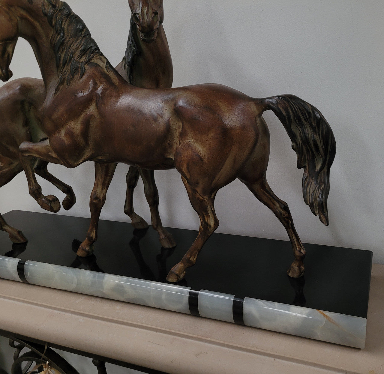Art Deco patinated bronze French spelter horses on a stunning marble base. It is in good original detailed condition.