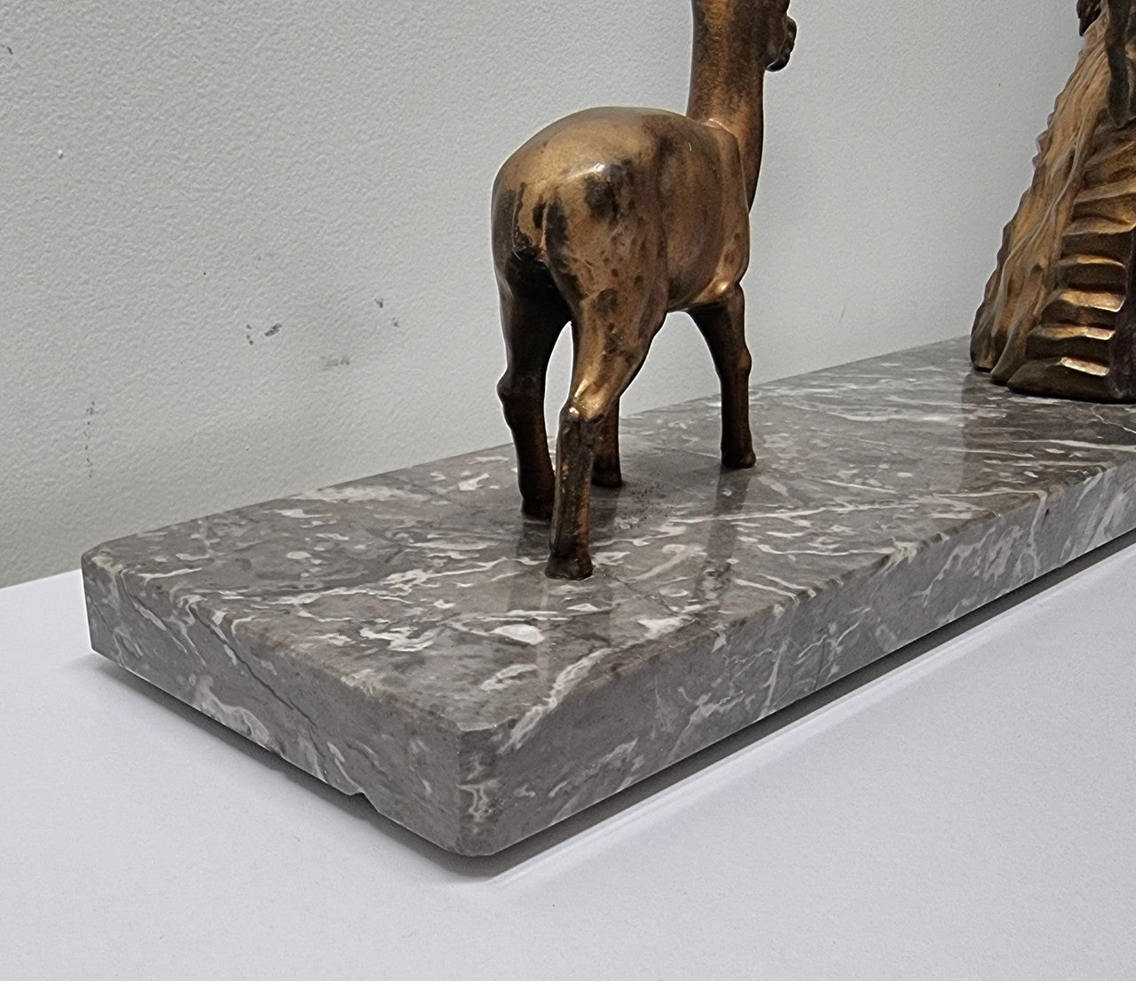 Art Deco gilt metal lady and deer statue on a lovely grey marble base. It has been sourced from France and is in good original condition. The marble does have some minor chips and wear due to age, please view photos as they help form part of the description. Please contact us if you would like additional photos.
