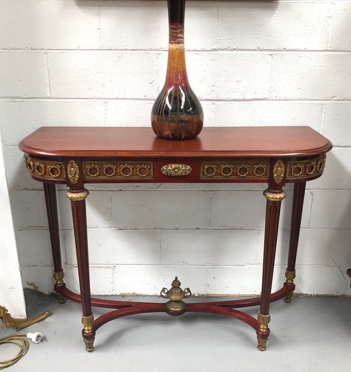 Fully restored decorative French style mahogany console table, with beautiful ormolu mounts and in very good condition.