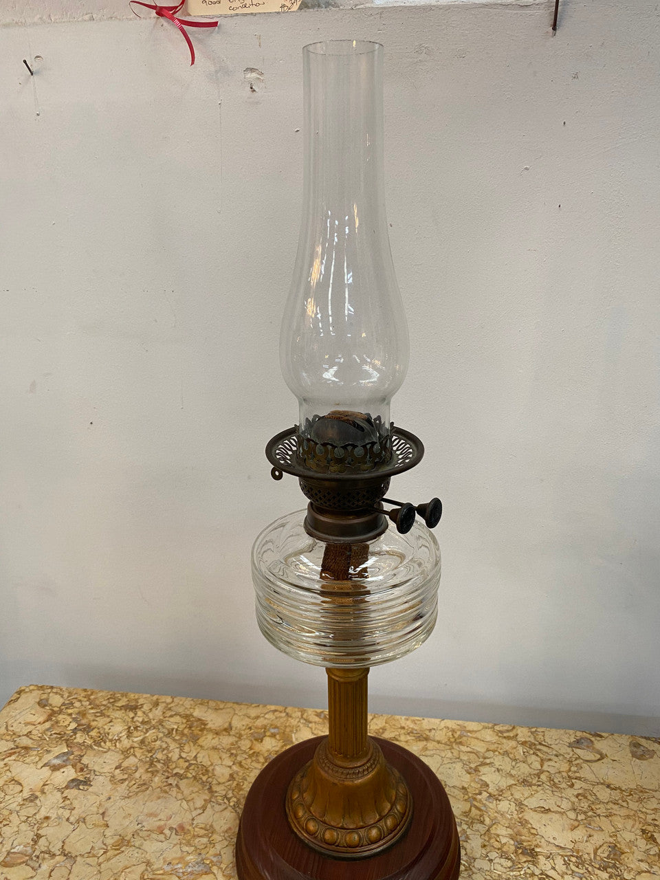 Edwardian ribbed glass kero lamp on a turned wooden base. Circa 1900's.