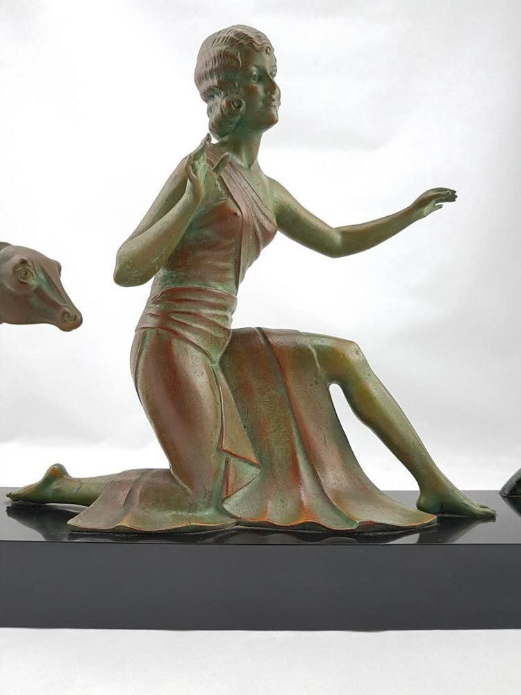 Absolutely gorgeous French cold painted metal Art Deco Statue of a lady and two deers on a marble base. Signed piece and in good original condition.