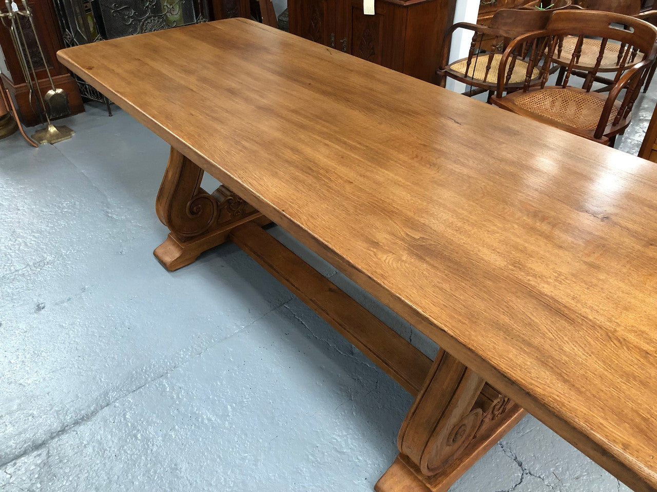 French oak fixed farmhouse table with a charming harp-shaped base. In good original condition and can seat 6-8 people. Circa 1930.