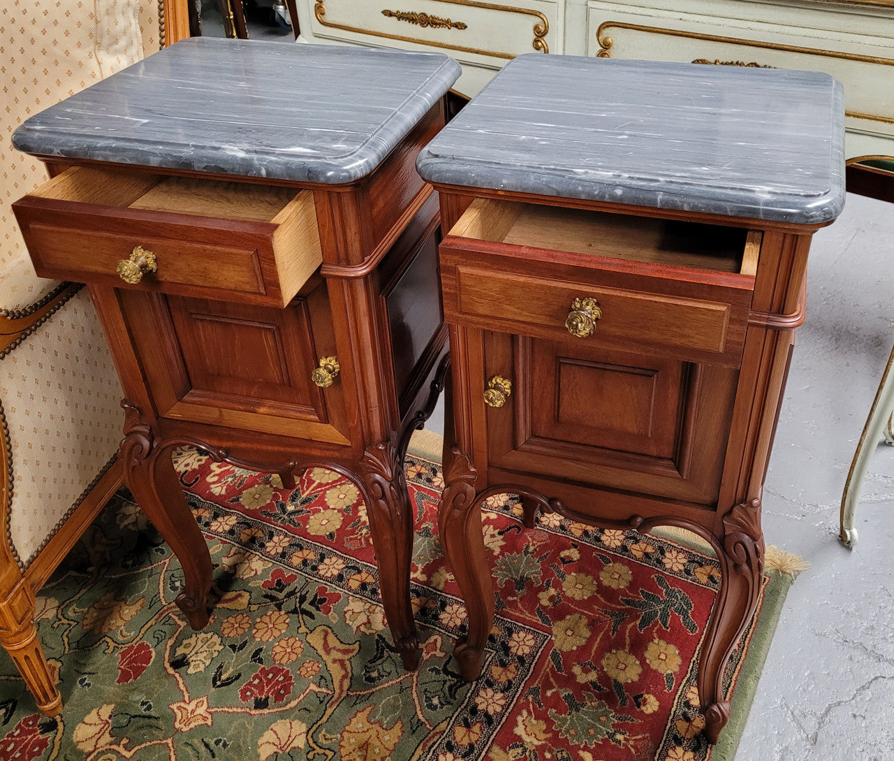 Pair of Walnut Louis XV style grey marble top bedside cabinets. Single drawer, one cupboard and lovely French cabriole legs. They have been sourced from France and are in good original condition.