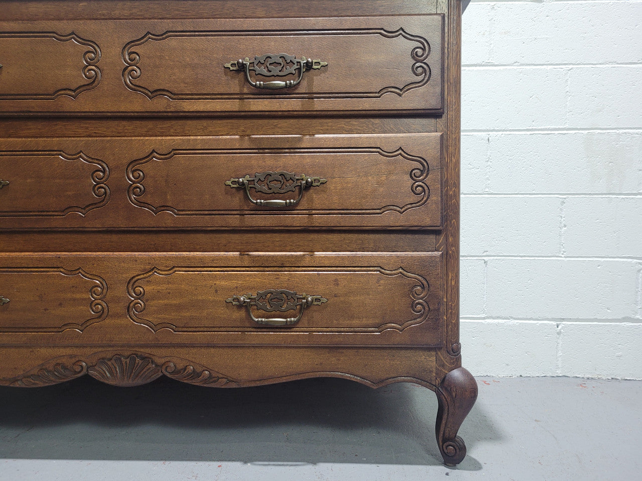 Louis XV style French Oak chest of three drawers that has been sourced from France. It is in good original condition and has been detailed.