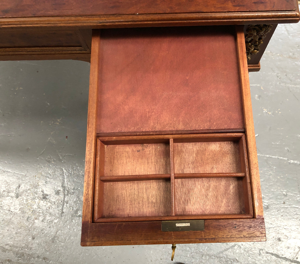 Lovely French Mahogany Louis XVI style leather top desk. With beautiful ormolu details and three drawers. There are also two slides on either side with tooled leather tops and in good original detailed condition.