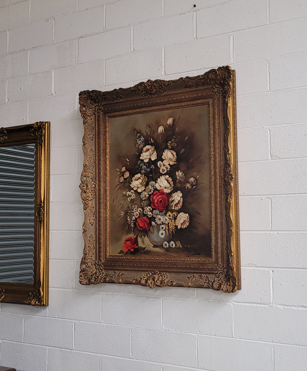 Attractive French floral oil on canvas - signed. Mounted in a stunning patterned gilded frame. It is in good original detailed condition.