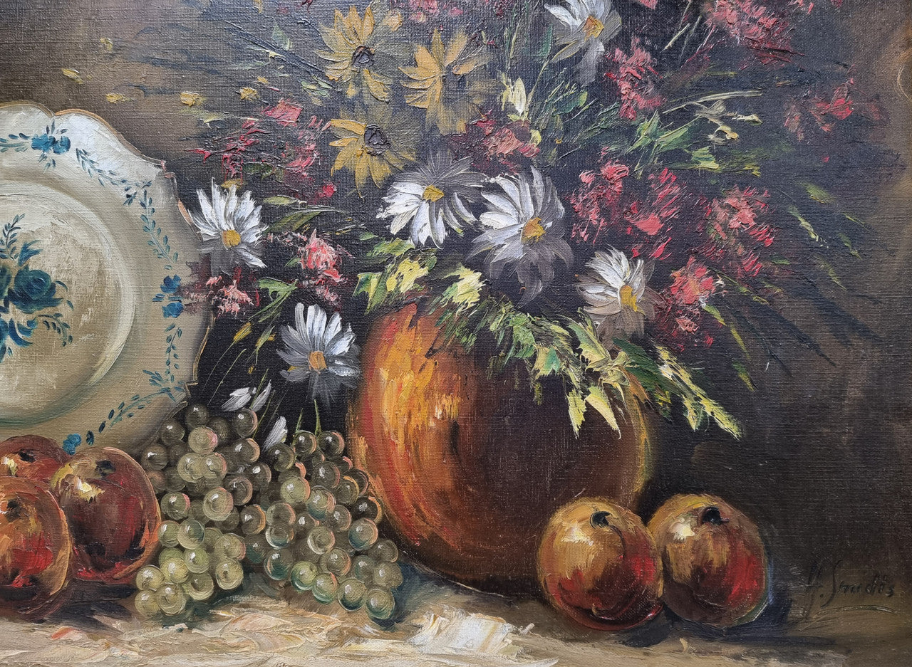 Beautiful signed oil on canvas of a still life framed in an ornate frame. Sourced in France and in good original condition.