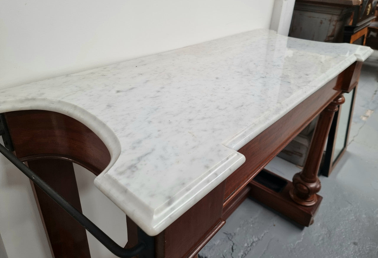 Classic Victorian mahogany console table with white marble top, one drawer and accommodation for sticks/umbrellas. In good original detailed condition.
