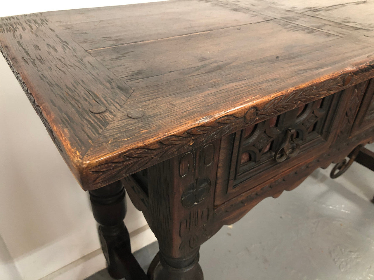 Spanish late 19th century carved oak three drawers console/side table. Superb wrought iron undercarriage. In good condition. Circa 1900's.