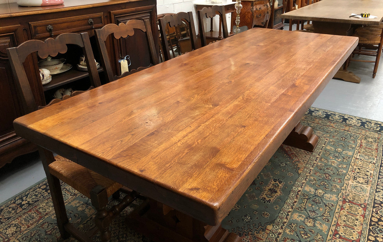 French Farmhouse table with a beautiful thick plank top and stretcher base. Can seat 8-10 people comfortably and is in good original detailed condition.