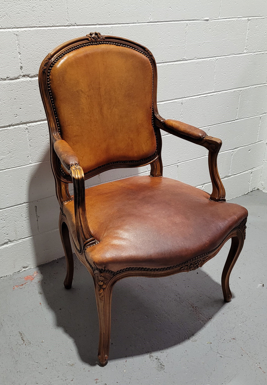French Walnut Louis XV style desk chair with faux leather upholstery. The upholstery is in good original condition and very comfortable to sit in.