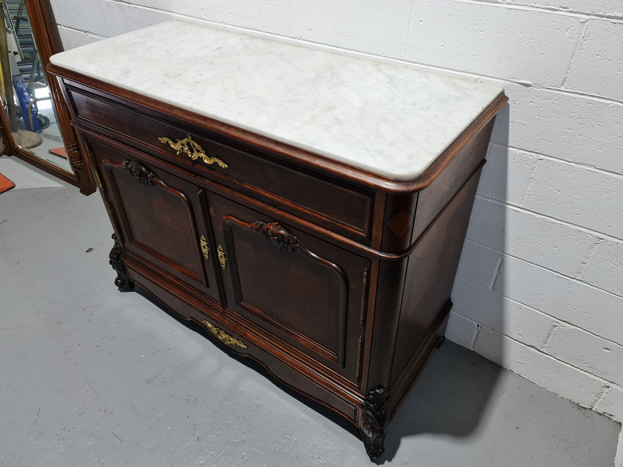 Stunning Rosewood Marble Topped Secretaire with two cupboards. Cupboards open to three fitted drawers and an additional secret drawer beneath the cupboard. All sitting on lovely carved legs and decorated with ormolu mounts. Circa: 1860. In good original detailed condition.