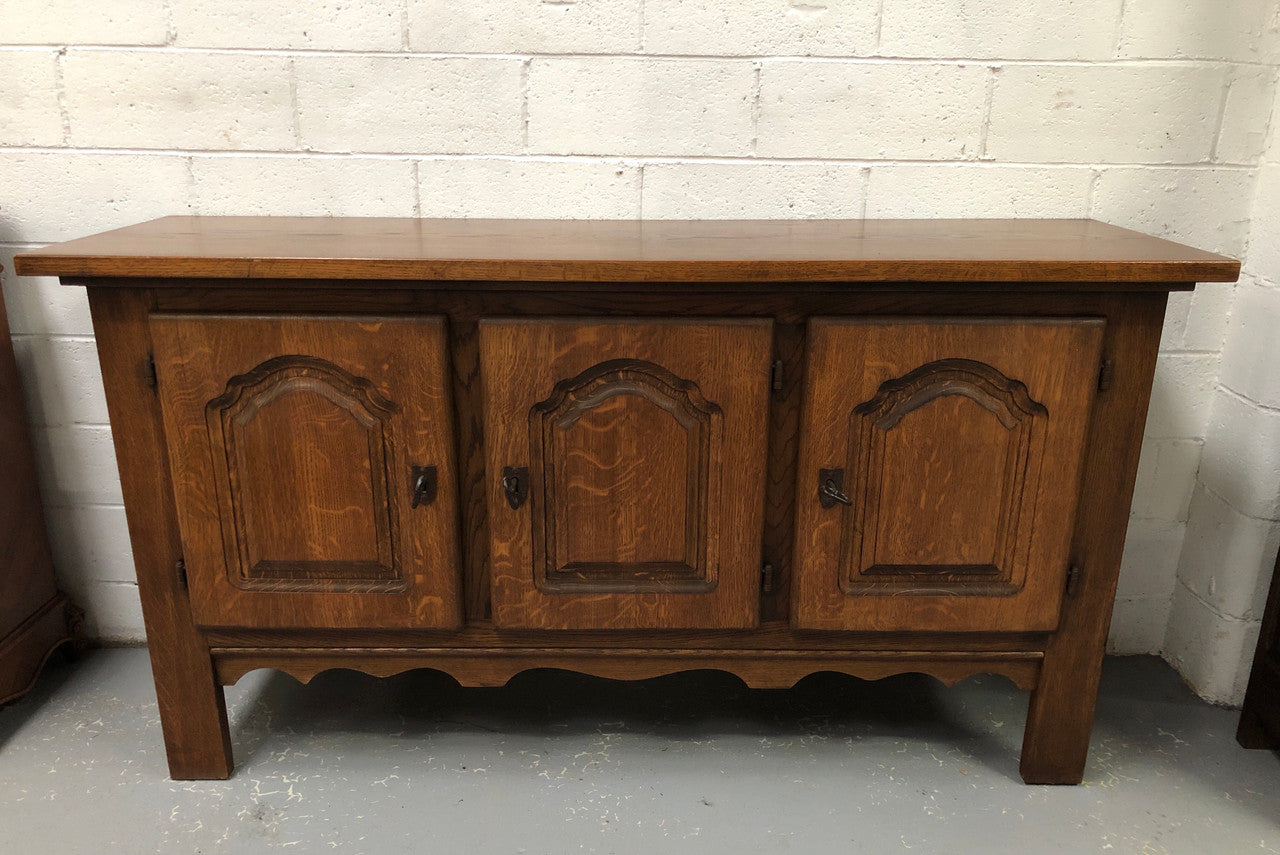 Solid and rustic French oak three door cabinet with plenty of room for storage and all doors lock with heavy duty iron keys.