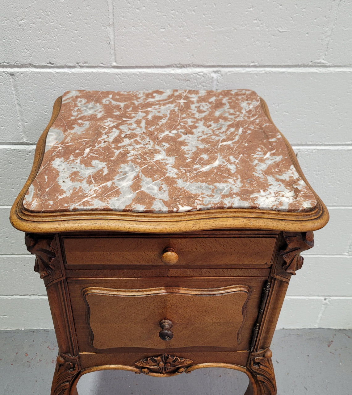 Single French Louis XV style Walnut inset marble top bedside. It has one drawer and one cupboard. It is in good original detailed condition.