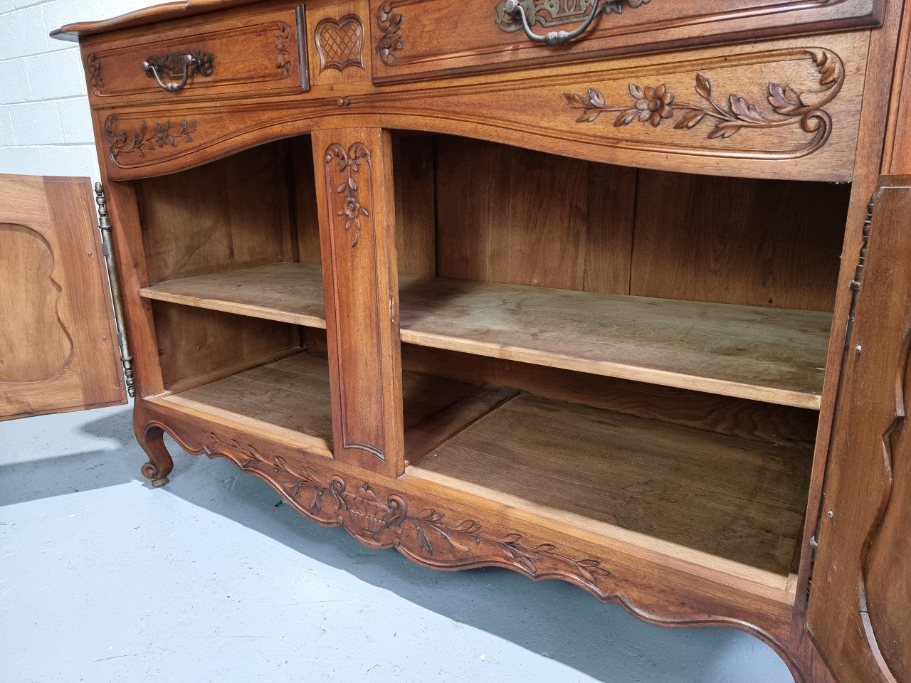 Stunning 19th Century French Walnut Buffet à Glissant from Provence, France. This is an exceptional charming piece and very functional with plenty of storage space, two large cupboards at the bottom, two drawers in the middle and two sliding doors either side at the top and finished off with a small central cupboard. In good original detailed condition.