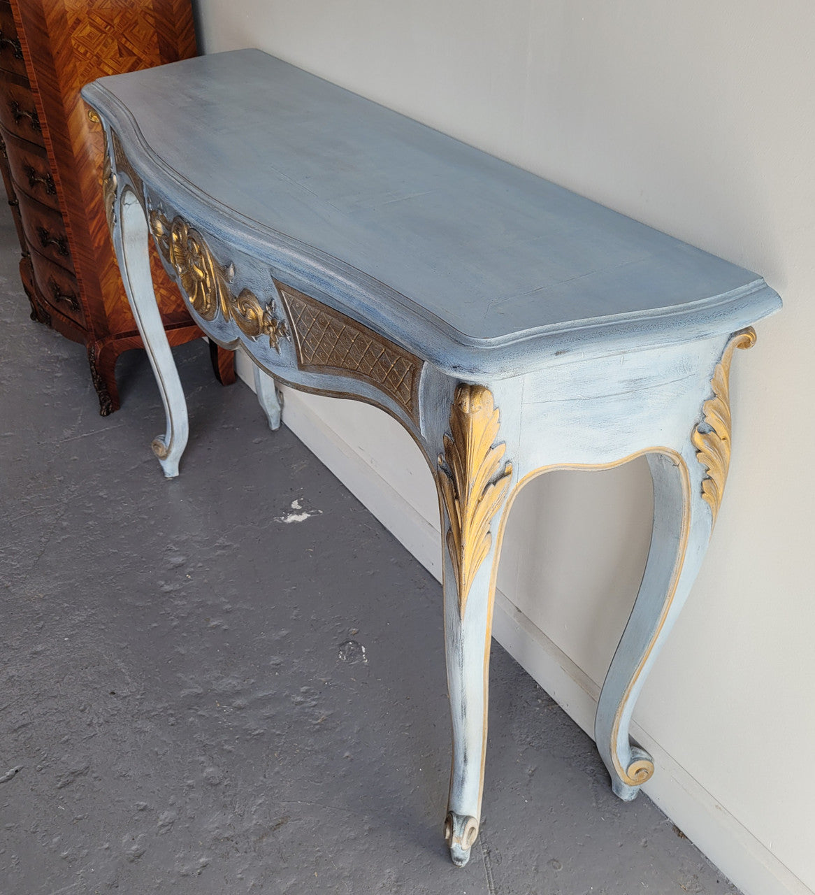 Stylish Louis 15th style console table with chalk paint and gilded highlights. They have been sourced from France and is in good original condition.
