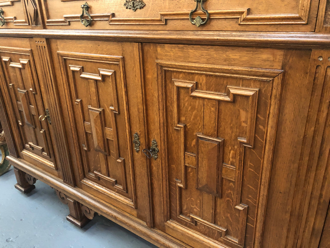 Beautiful carved French Oak four-door buffet with three drawers and lots of room for storage in good original detailed condition.