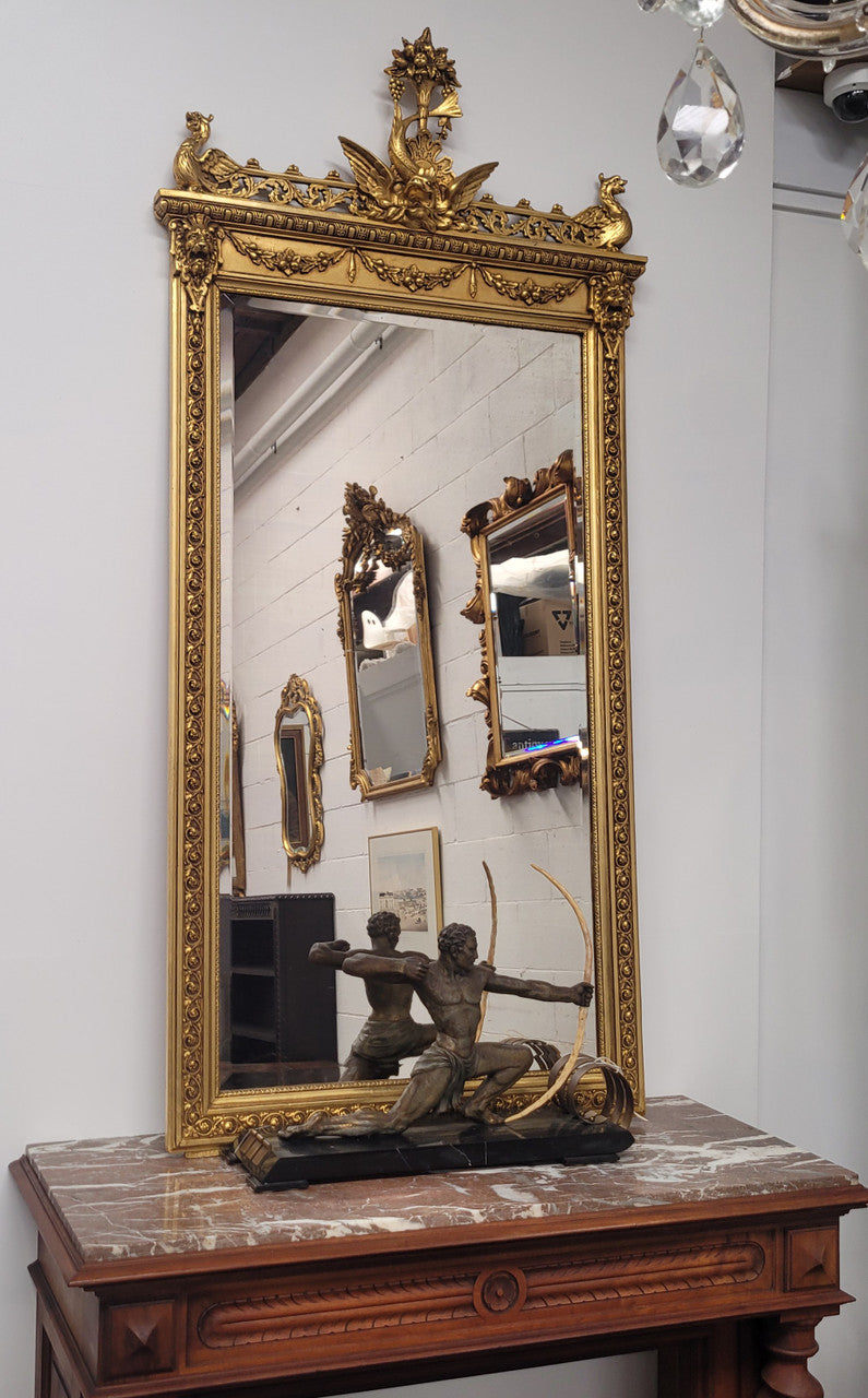 Impressive French Napoleon III water gilded mantle mirror. It is beautifully decorated with allegorical themes and has been sourced from France. In good original detailed condition with original mirror.