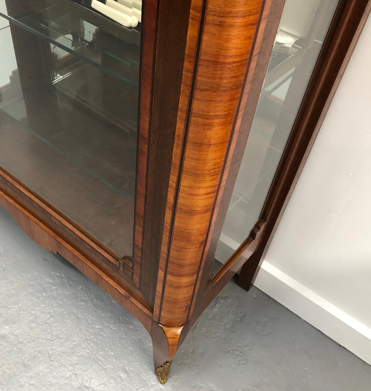 Beautiful French walnut and parquetry inlaid vitrine with lovely bevelled glass and a marble top. It comes with four glass shelves which are adjustable and it is in good original condition.