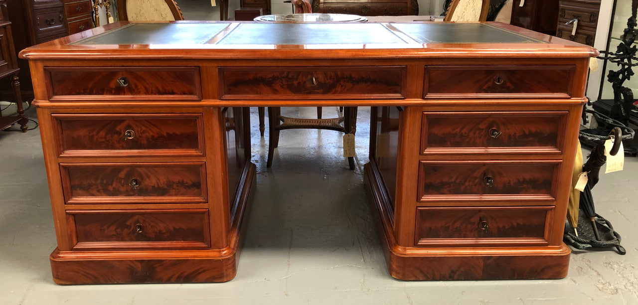 Antique French Mahogany and leather inset top double pedestal partners desk. Plenty of storage space with 9 long drawers on one side and space for someone to sit on the other side. In good restored condition. Circa 1880's.