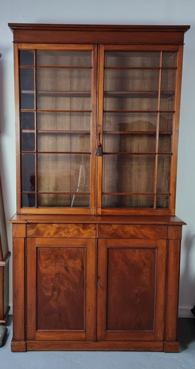 Rare early Australian colonial full Cedar bookcase. Plenty of storage underneath and glass top doors open up too three fully adjustable shelves. In good restored condition.