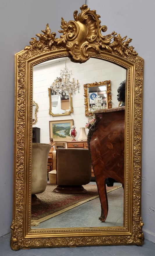 Late 19th Century French Louis XV style carved gilt wall mirror. Sourced from France and in good original detailed condition.