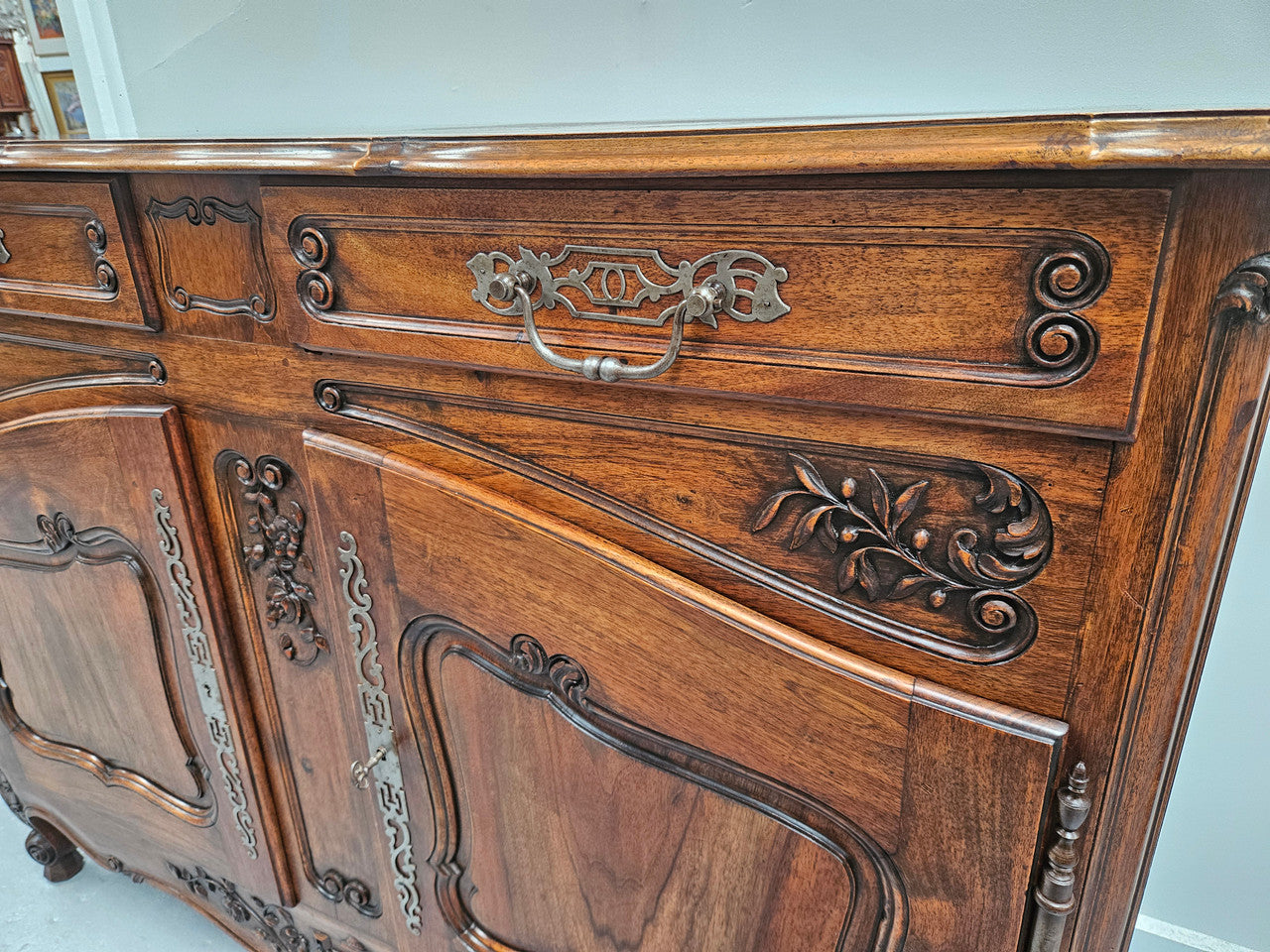 Attractive French Walnut Louis XV style two door two drawer sideboard featuring beautiful carving. Circa: 1930's. It has been sourced from France and it is in good original detailed condition.