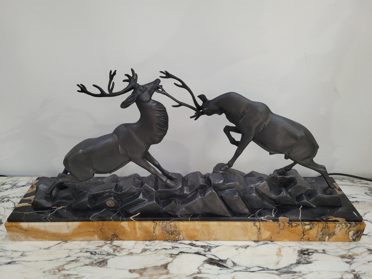 French Art Deco bronzed spelter and marble"Fighting Stags" statue by renowned artist and sculptor "Irenee Rochard".