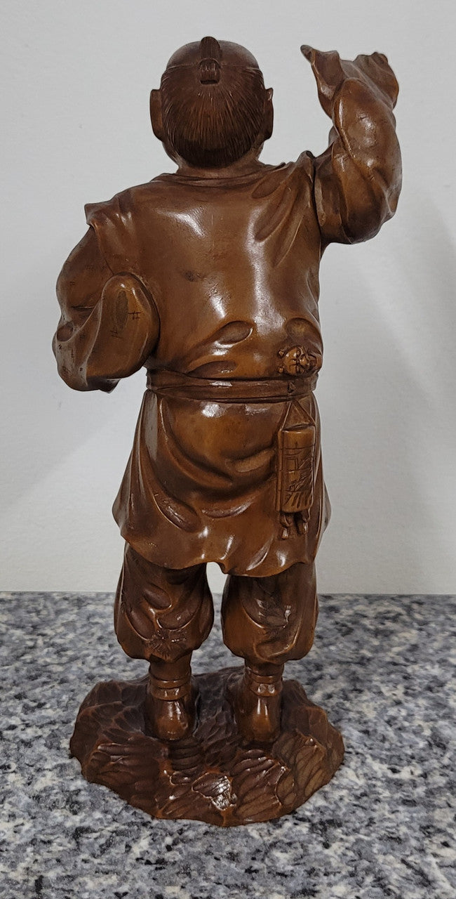 Exceptional Japanese Meiji period boxwood carving of a Peach Seller. Circa 1880's and it is signed to base. It is in good original condition, please view photos as they help form part of the description.