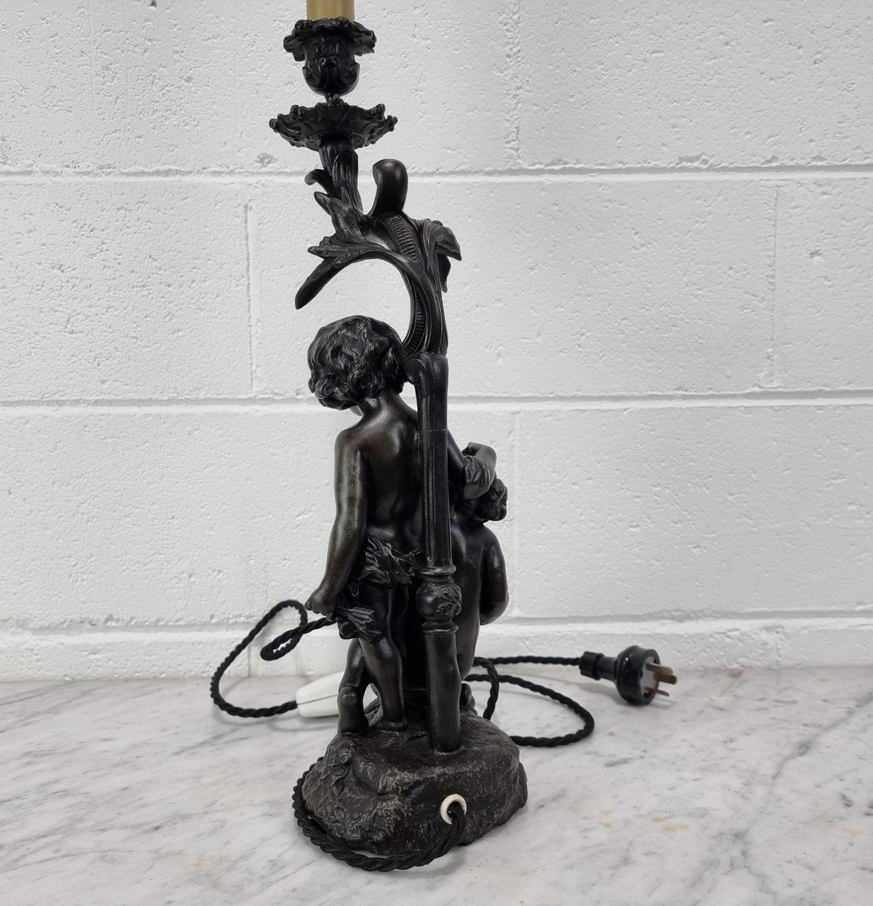 Antique French bronzed metal lamp with cherub's. in very good working original detailed condition.