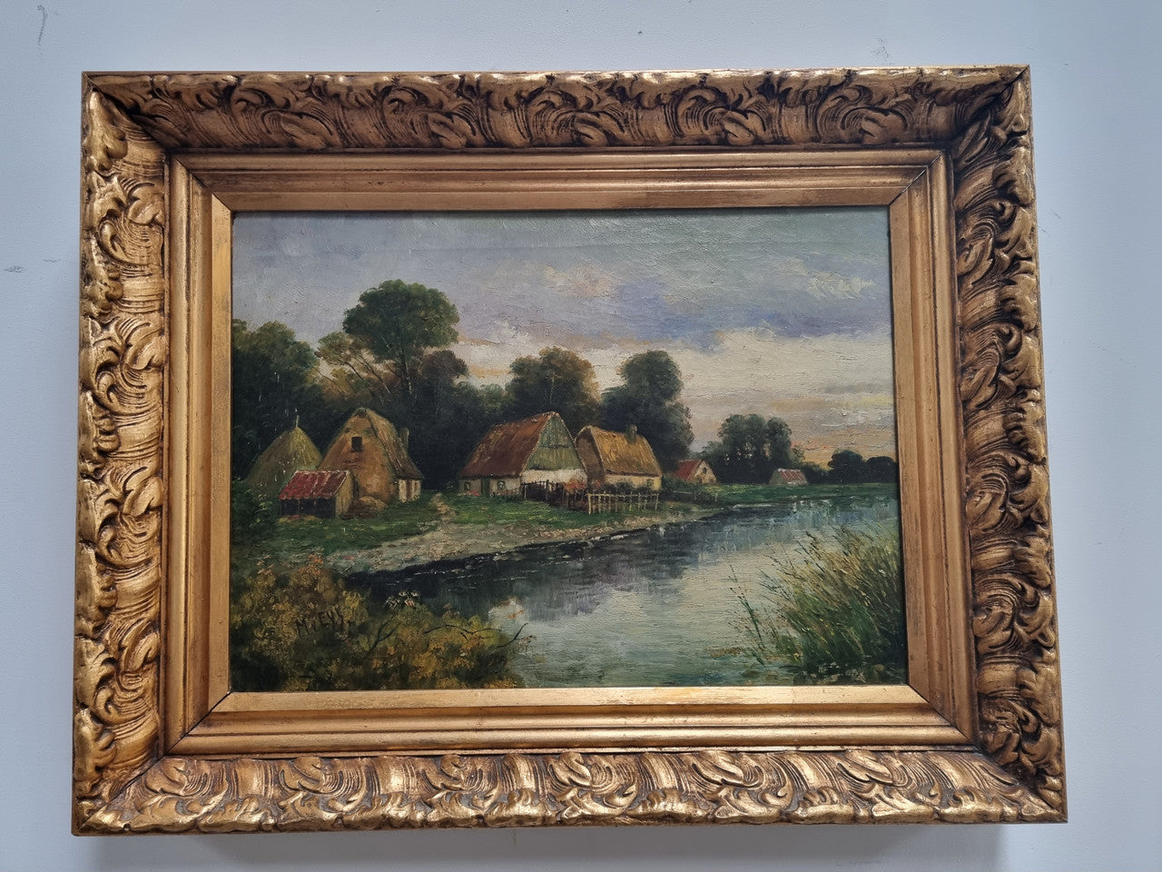 Lovely framed original oil on canvas of a country cottage scene on a river in good original condition