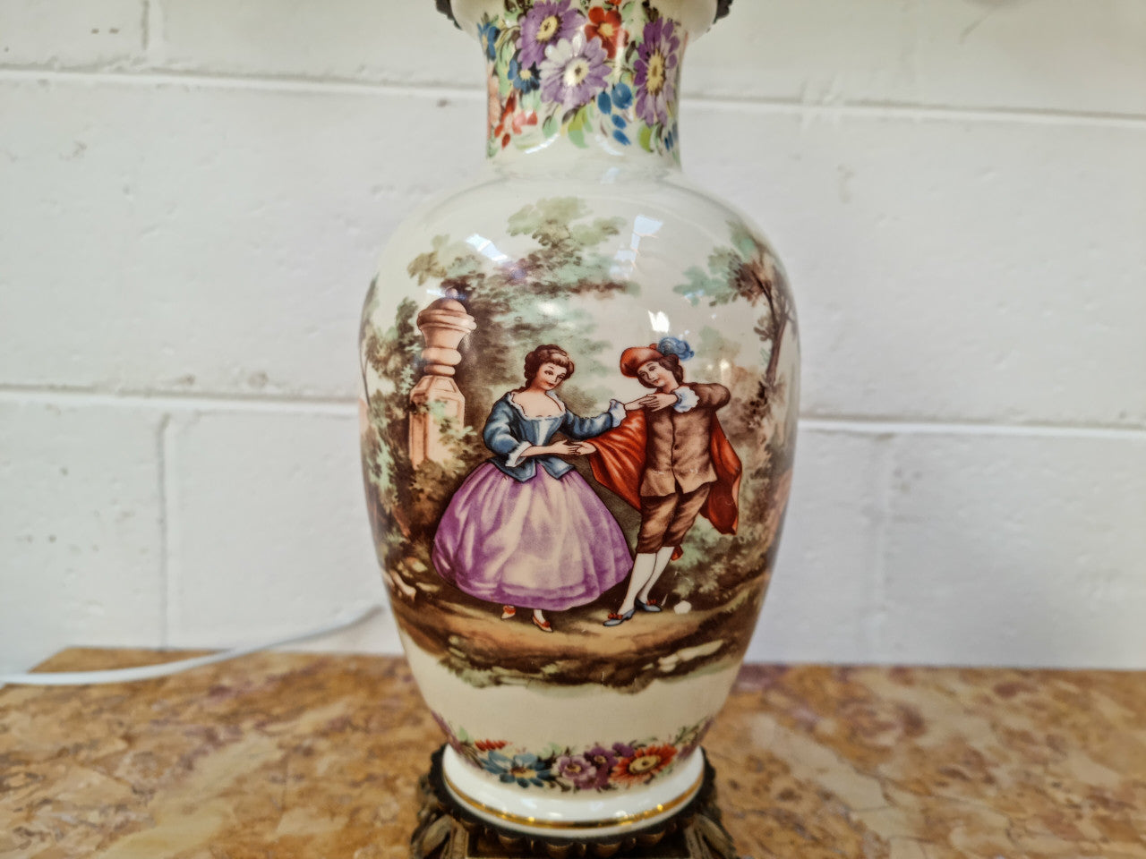 Beautiful French ceramic hand painted and transferred decorative table lamp. It has a lovely gilt bronze base and in good working order.