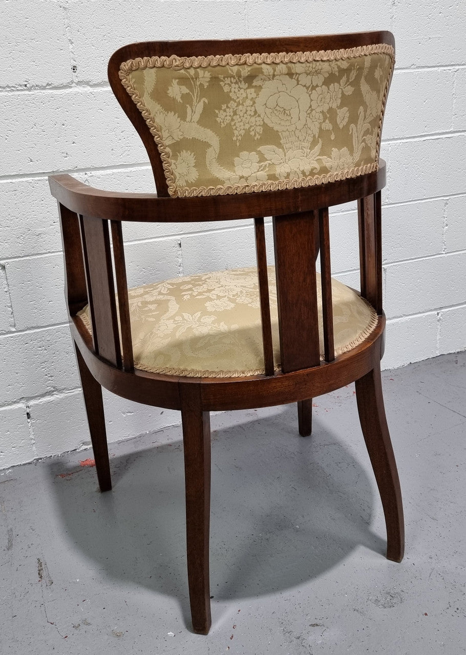 Charming Edwardian inlaid walnut upholstered armchair. In good original condition.