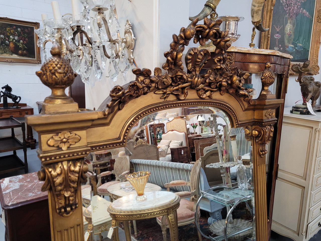 French Louis XVI style Napoleon III (1870’s) gilt mantle mirror. Beautifully carved and decorated with original bevelled mirror showing signs of age. It is in good original detailed condition and has been sourced from France.