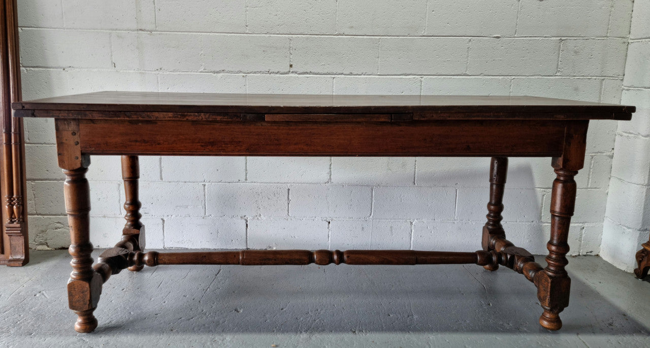 Appealing and rare French Oak Farmhouse extension table. Charming character to the top and comfortably seats 12 people. In good original detailed condition.