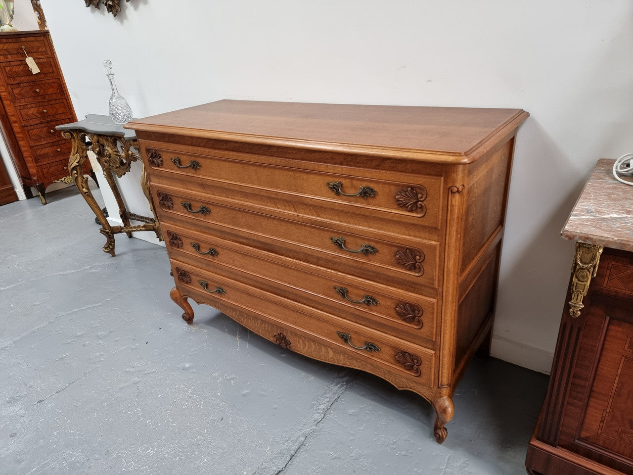 Fabulous French light Oak of chest of four drawers with lovely decorative carving. In good original detailed condition.
