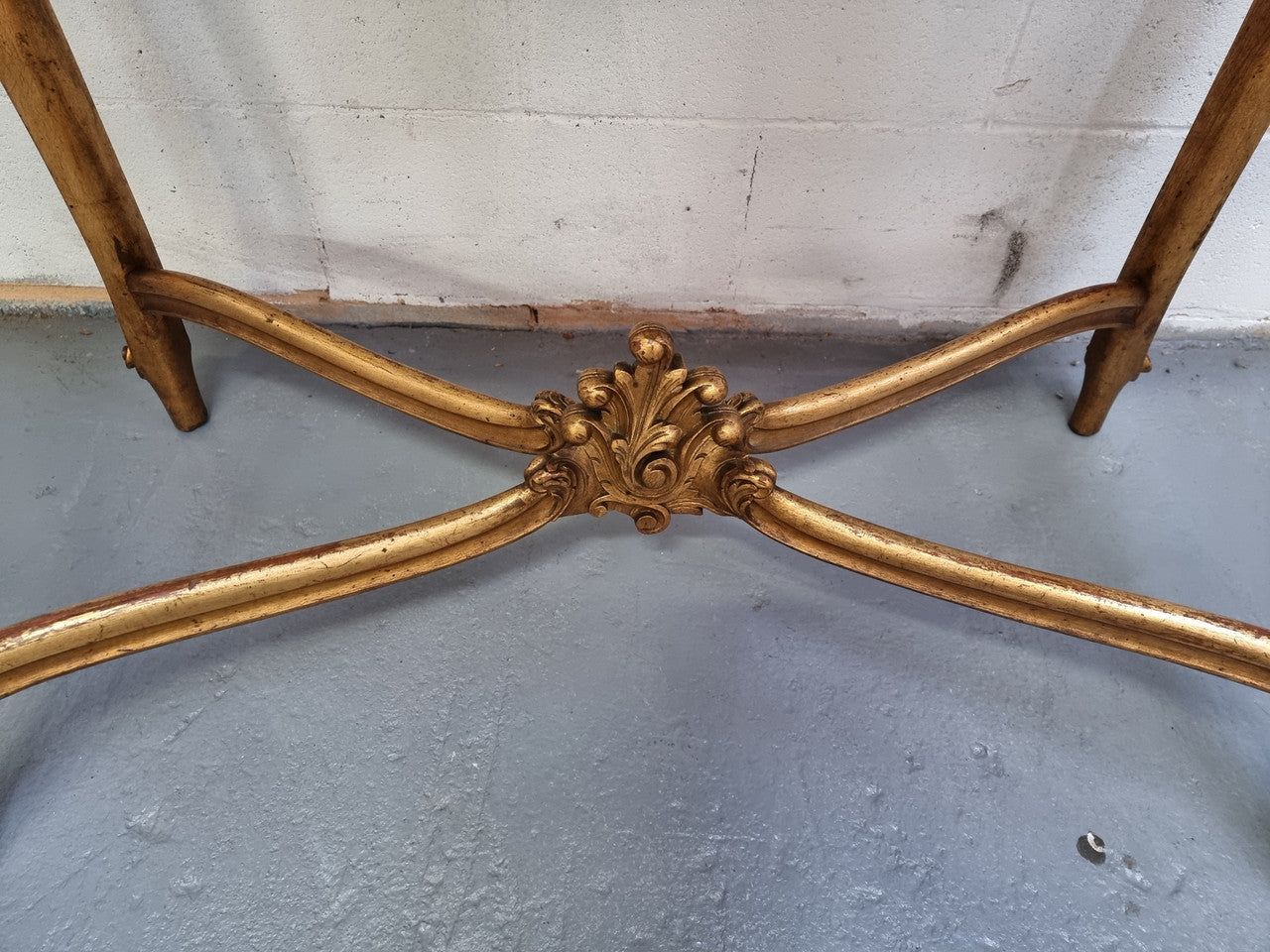 French Louis XV style carved center table with a stunning marble top and original gilt. In good original detailed condition.