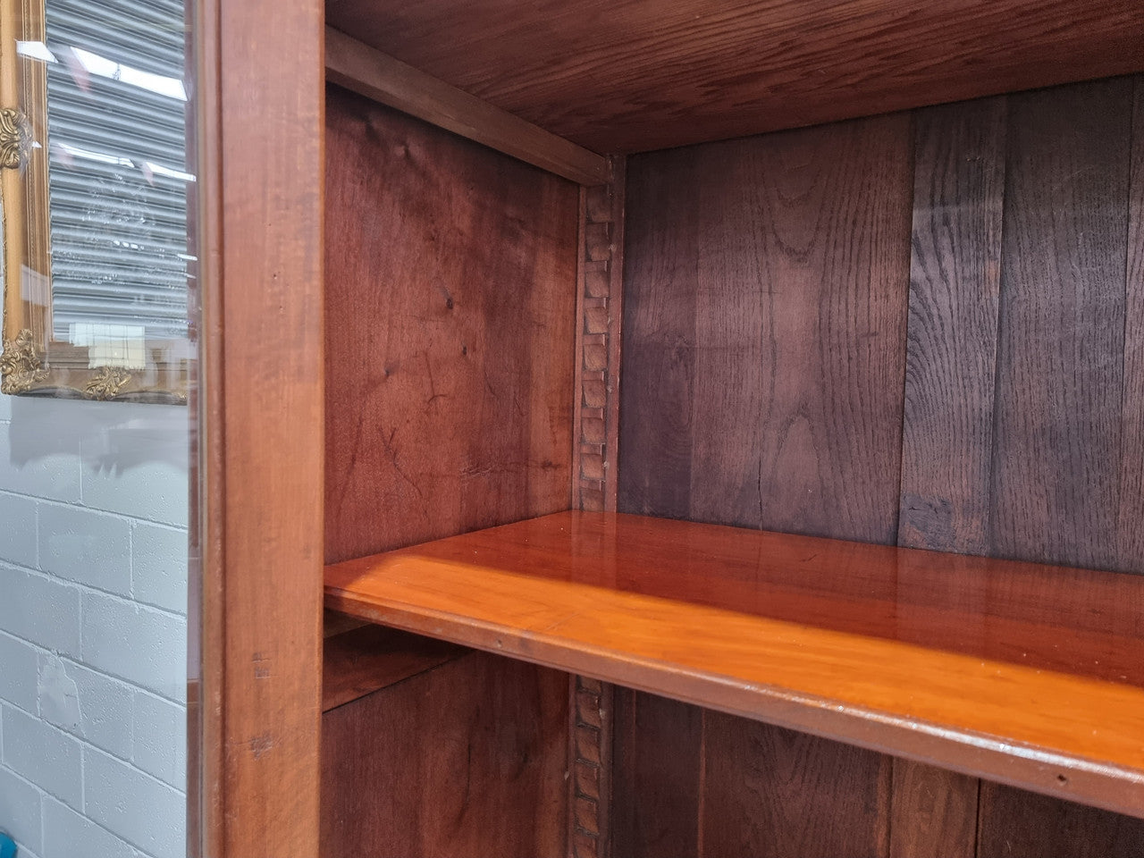 Grand French Mahogany Empire two door bookcase. It has beautiful glass doors and has three fully adjustable shelves. It has been sourced from France and is in good original detailed condition.