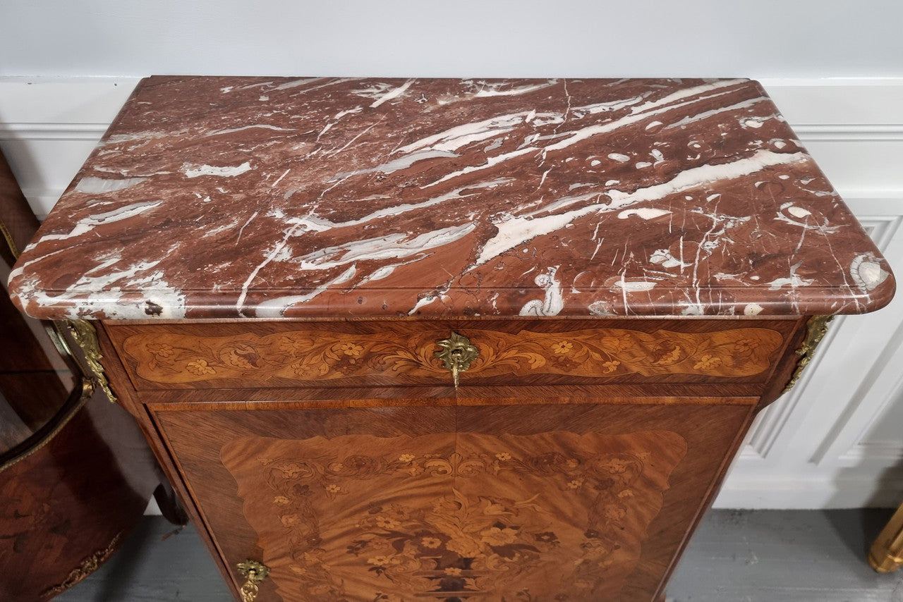 Elegant French transitional style Walnut & Kingwood Salon cabinet. It has beautiful marquetry inlay, a marble top and decorative ormolu mounts. Sourced From France and is in good original detailed condition.