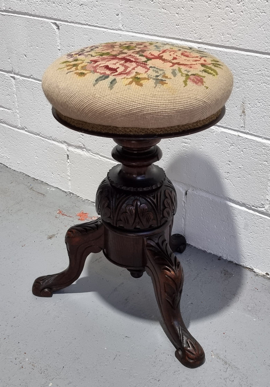 Beautiful Late Victorian Floral tapestry covered revolving piano stool. It is in very good original detailed condition. It has a original David Jones label underneath .