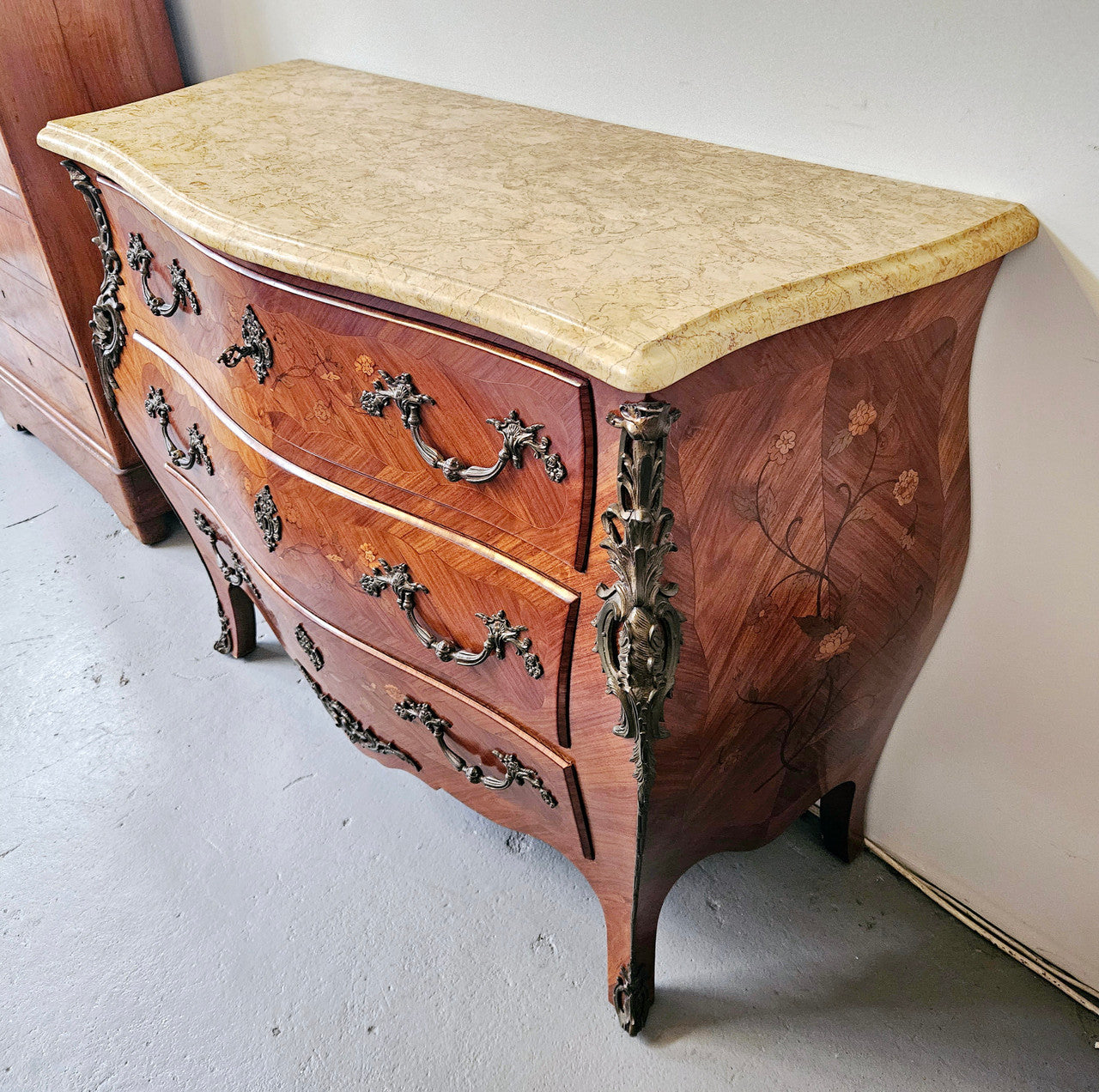 Stunning French Louis 15th style marble topped three drawer commode with marquetry inlay and stunning ormolu mounts. In good original detailed condition.