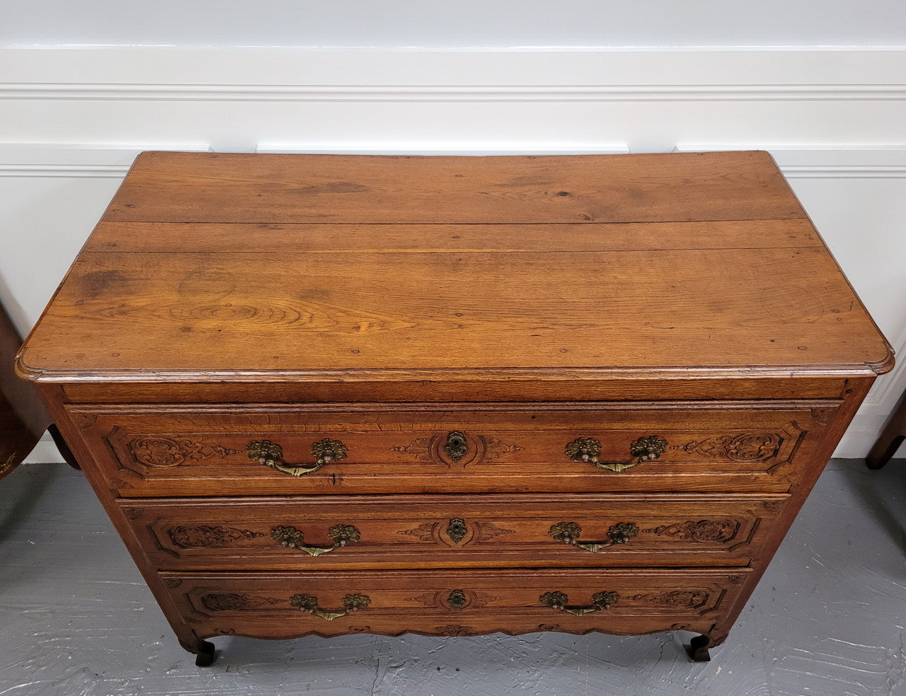 French Louis 15th style large three drawer chest featuring carved drawers. It has been sourced from France and is in good original detailed condition.