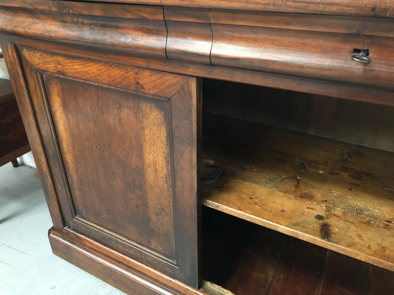 Lovely Early 19th Century French Walnut counter/sideboard with two drawers and cupboards for all your storage needs. It is in good original detailed condition.